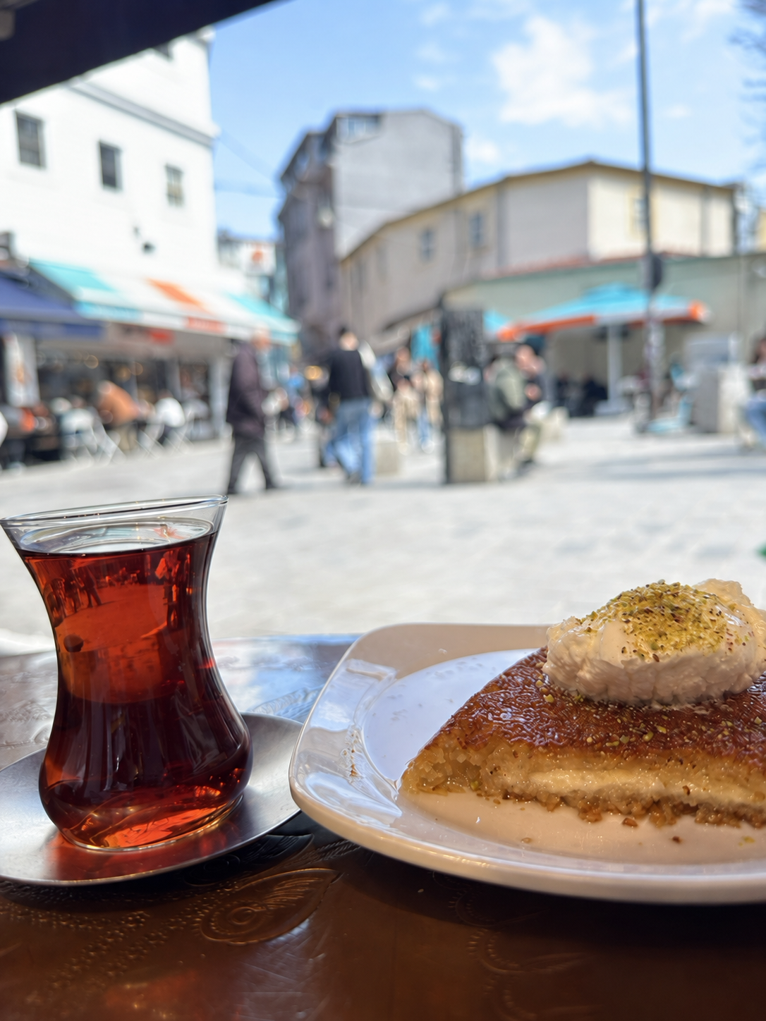 Tea and dessert overlooking a busy street